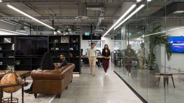 People walking inside of an office space