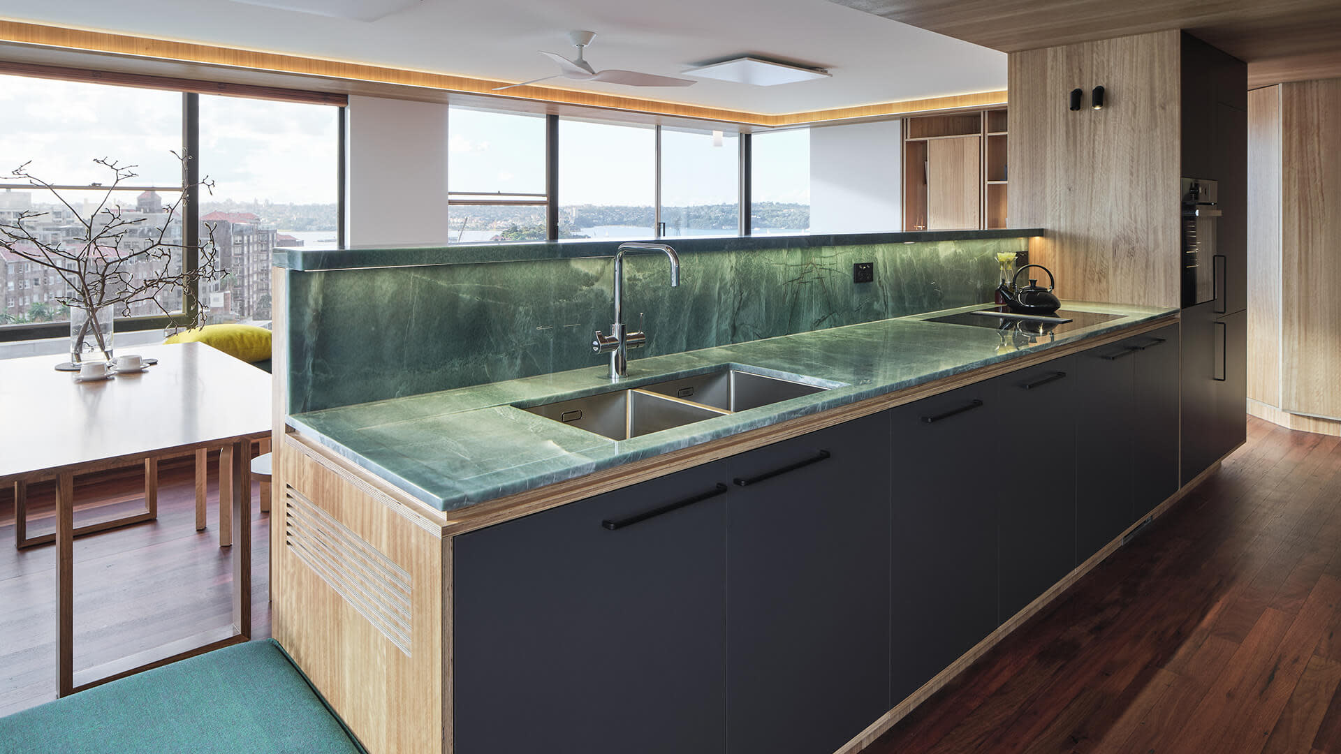 Modern shot of greenstone kitchen sink and surrounding areas.
