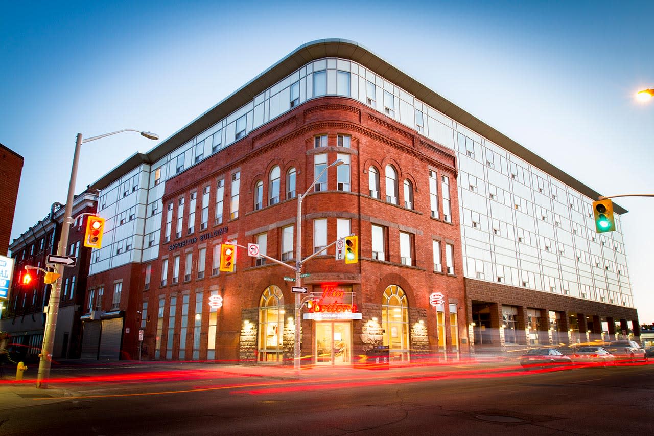 Low angle shot of building with a Tim Hortons