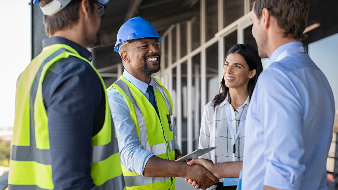 Construction workers collaborating on a jobsite