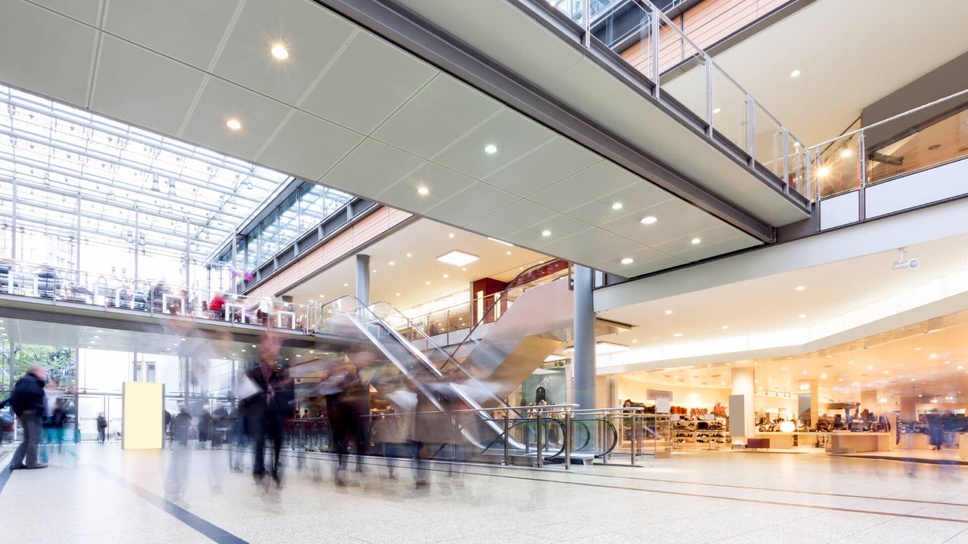 Interior of shopping mall with people on movement