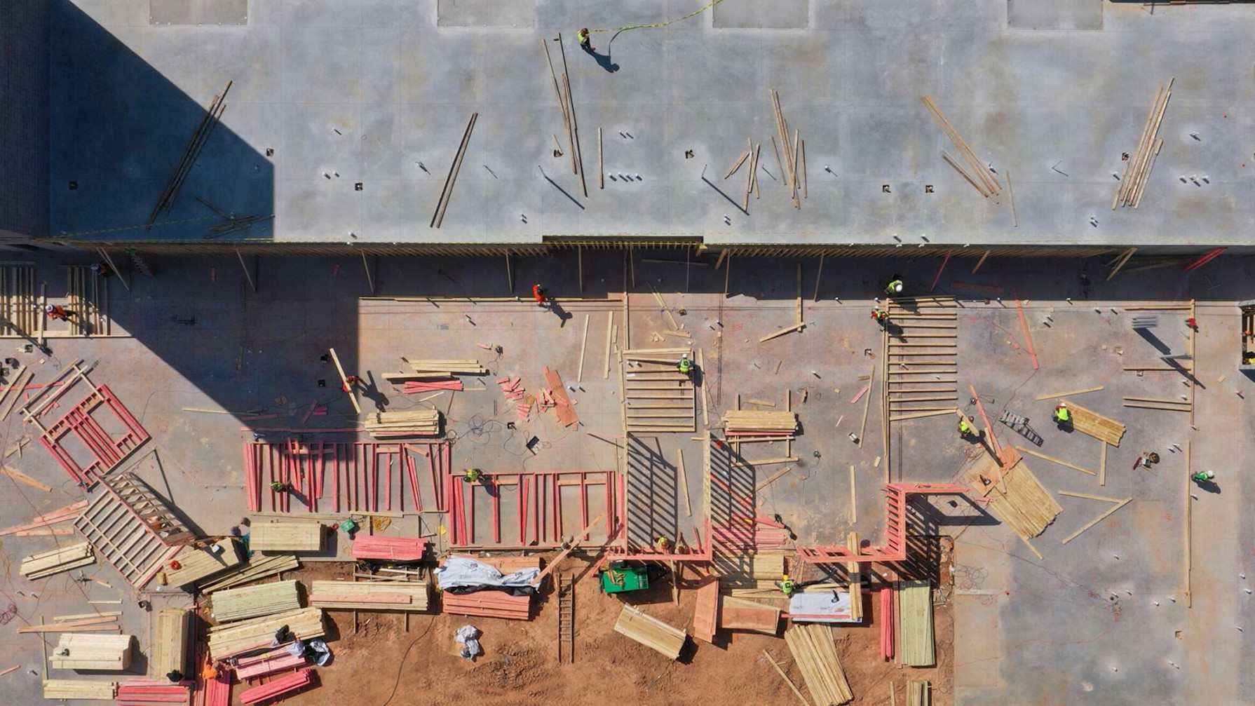 Aerial view of a construction site with workers in it