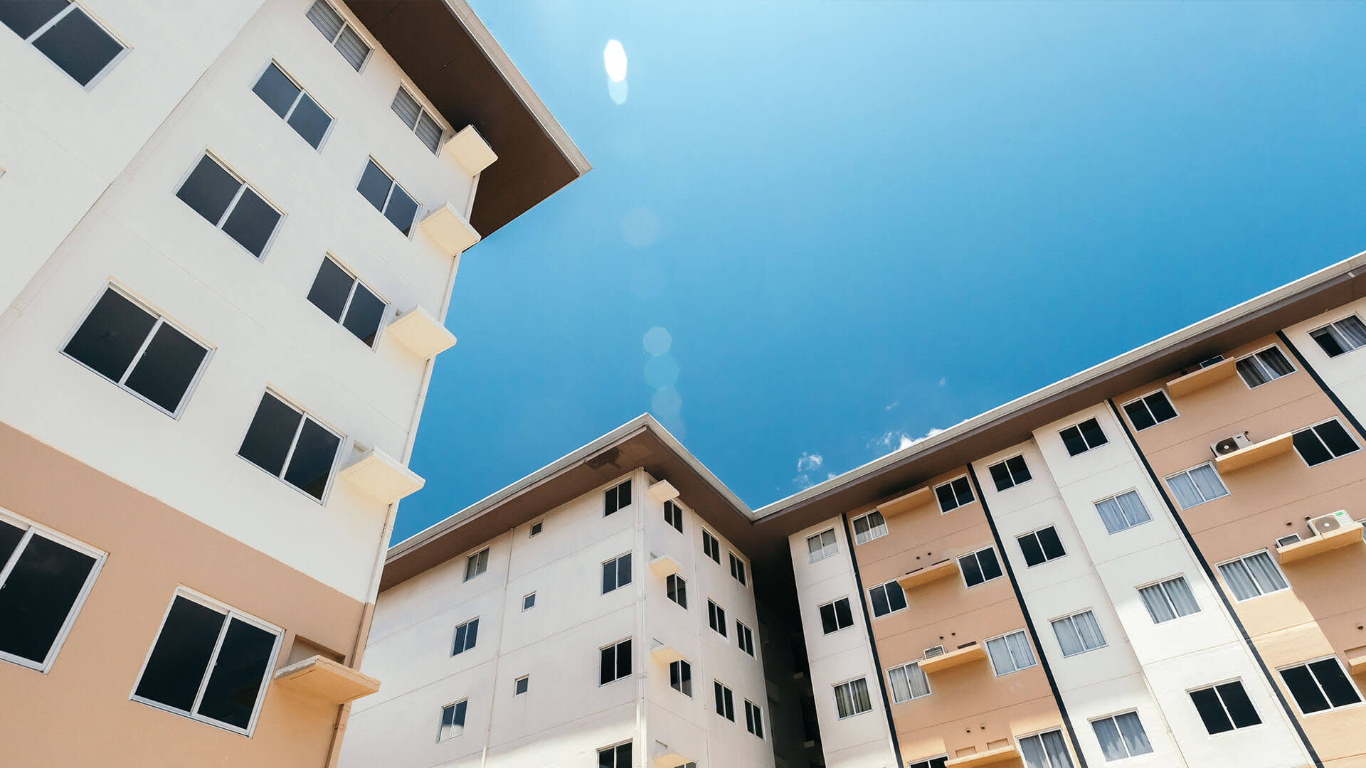 Low angle view of two similar buildings