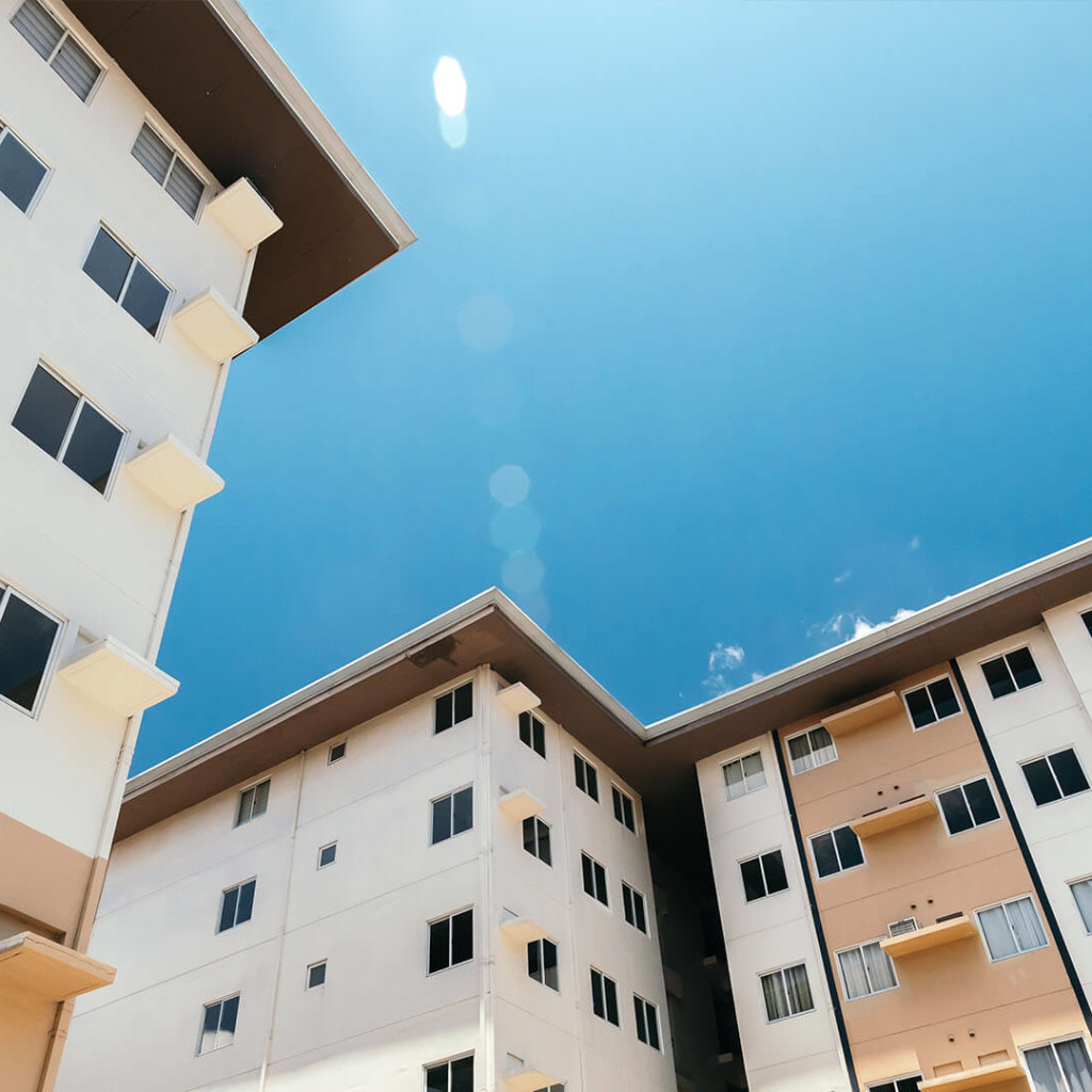 Low angle view of two similar buildings