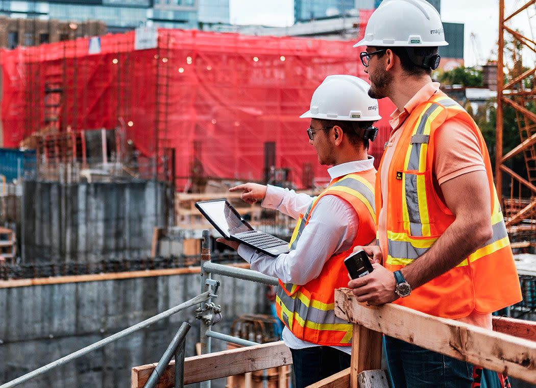 Contractors inspecting a site