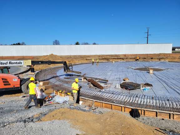 beams being moved into the construction site