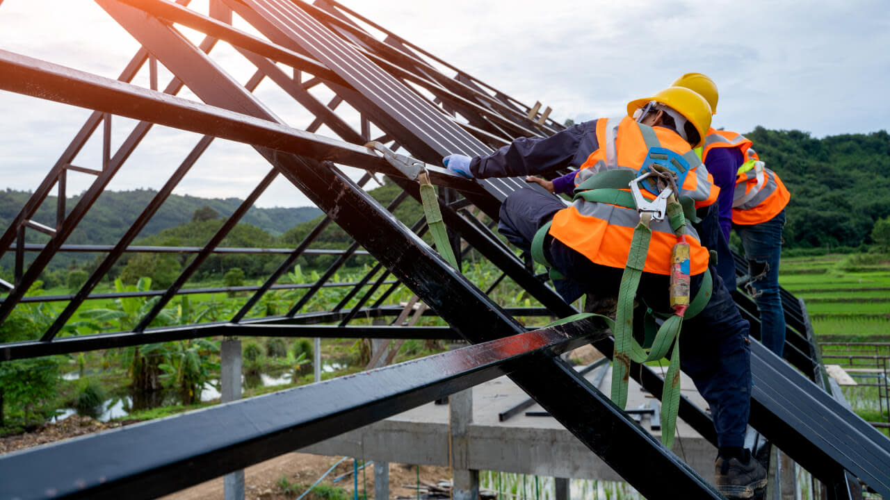 Construction workers on a roof