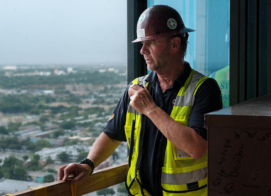 Contractor looking out the window
