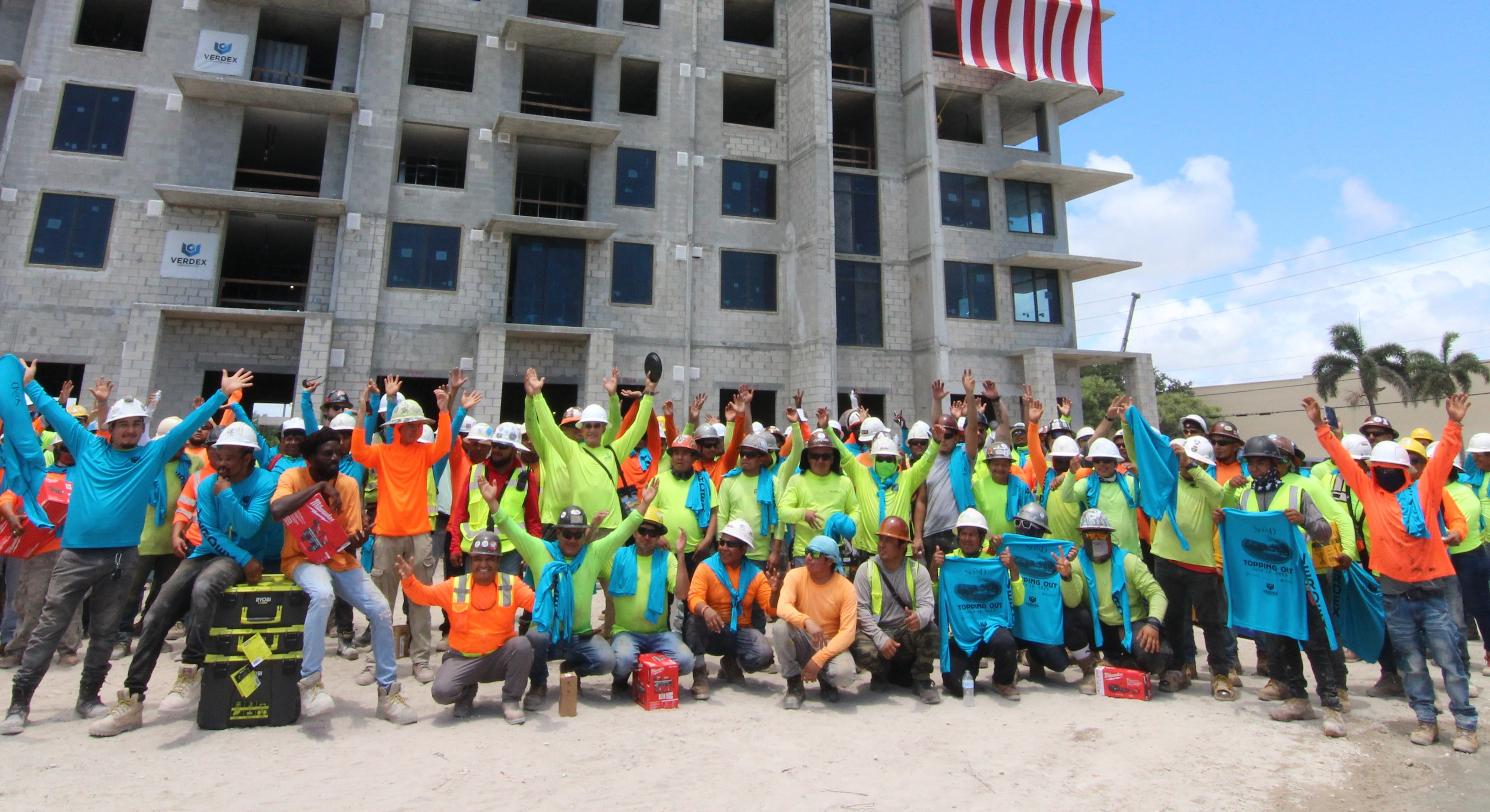 Verdex Team celebrating in front of active project