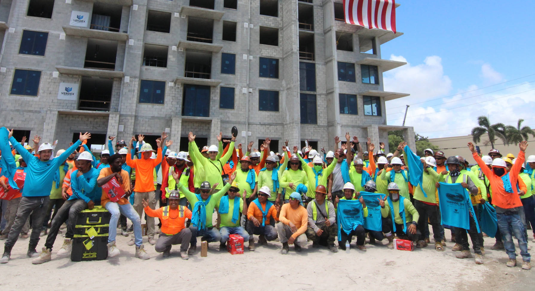 Verdex Team celebrating in front of active project