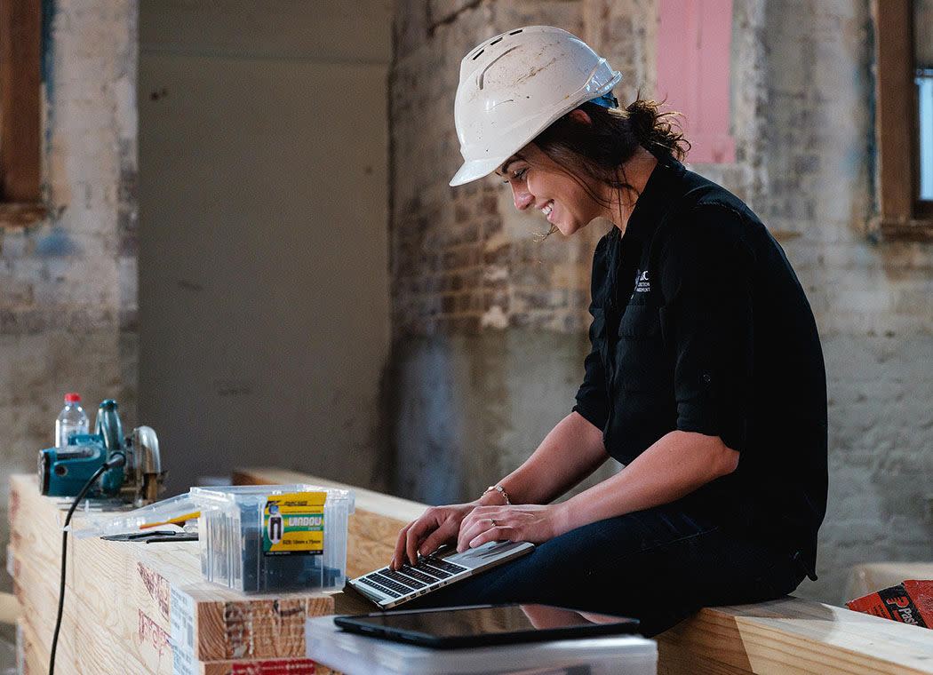 Woman contractor using her computer