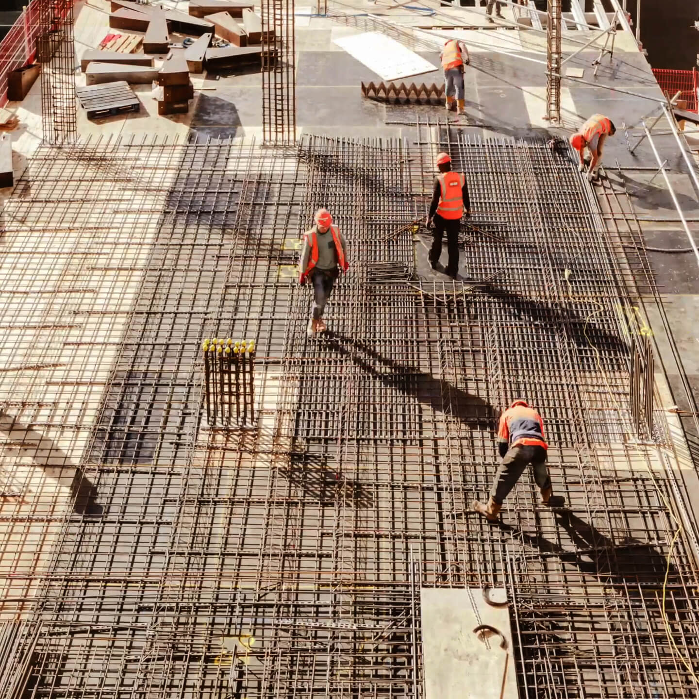 Construction workers finishing up a floor