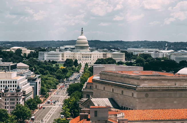View of the U.S. Capitol building with surrounding streets and buildings in Washington, D.C.