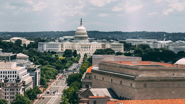 View of the U.S. Capitol building with surrounding streets and buildings in Washington, D.C.