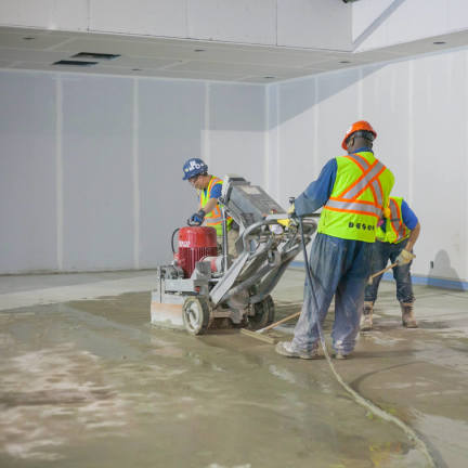 Desco workers flattening cement