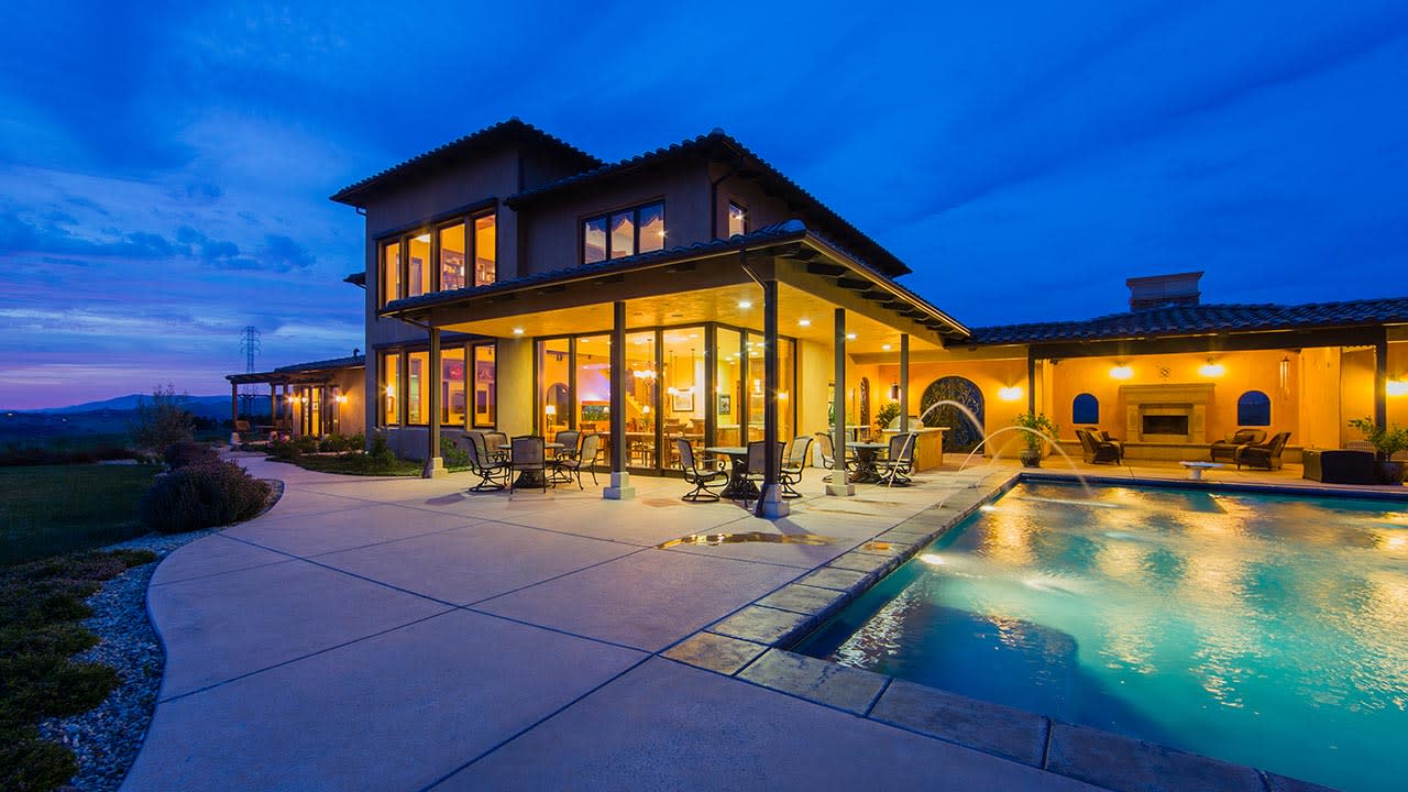 Pool area of a house during the evening