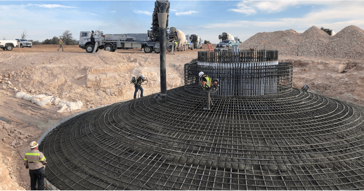 construction site with workers working on a round structure