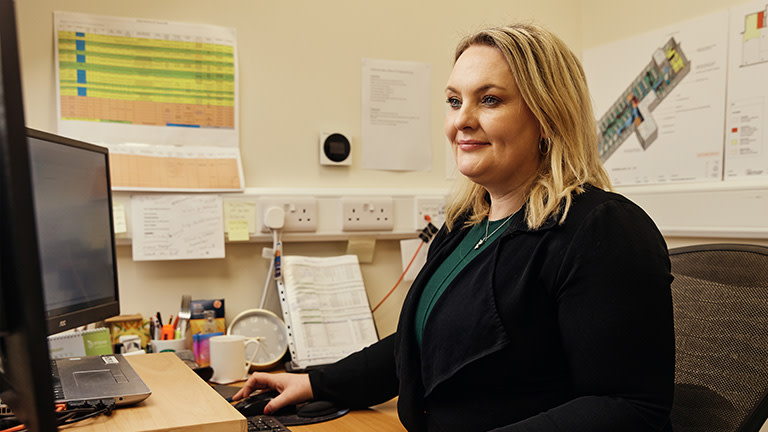 A woman working with a computer