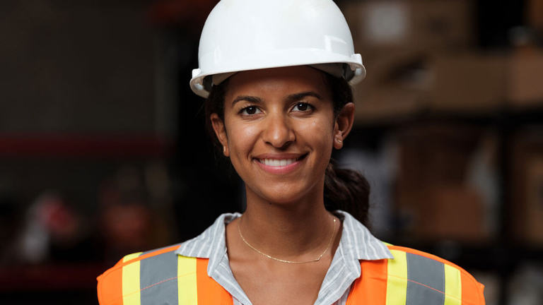 Woman construction worker smiling to the camera