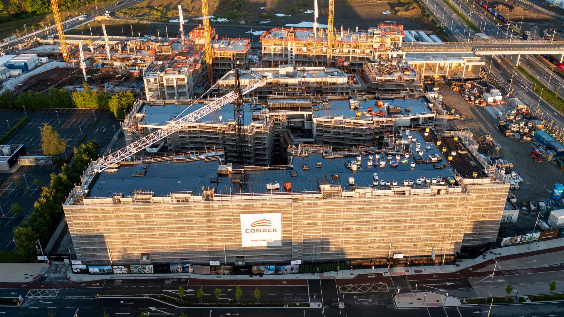 Aerial view of a large building under construction by Conack