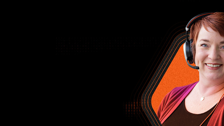 Woman with headphones on smiling to the camera