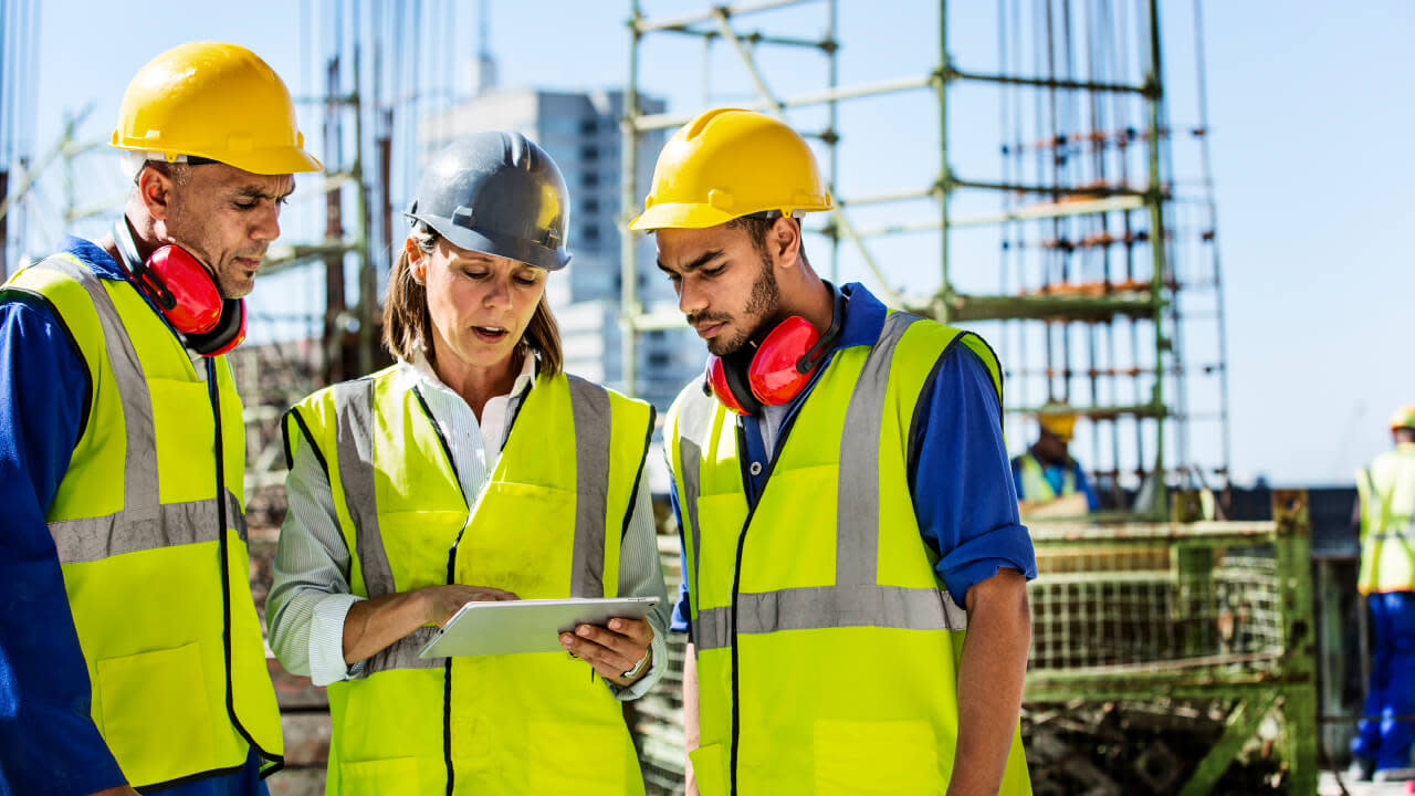 Construction workers collaborating on a jobsite