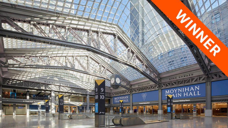 interior of Moynihan Train Hall station, with the "winner" banner on the top right