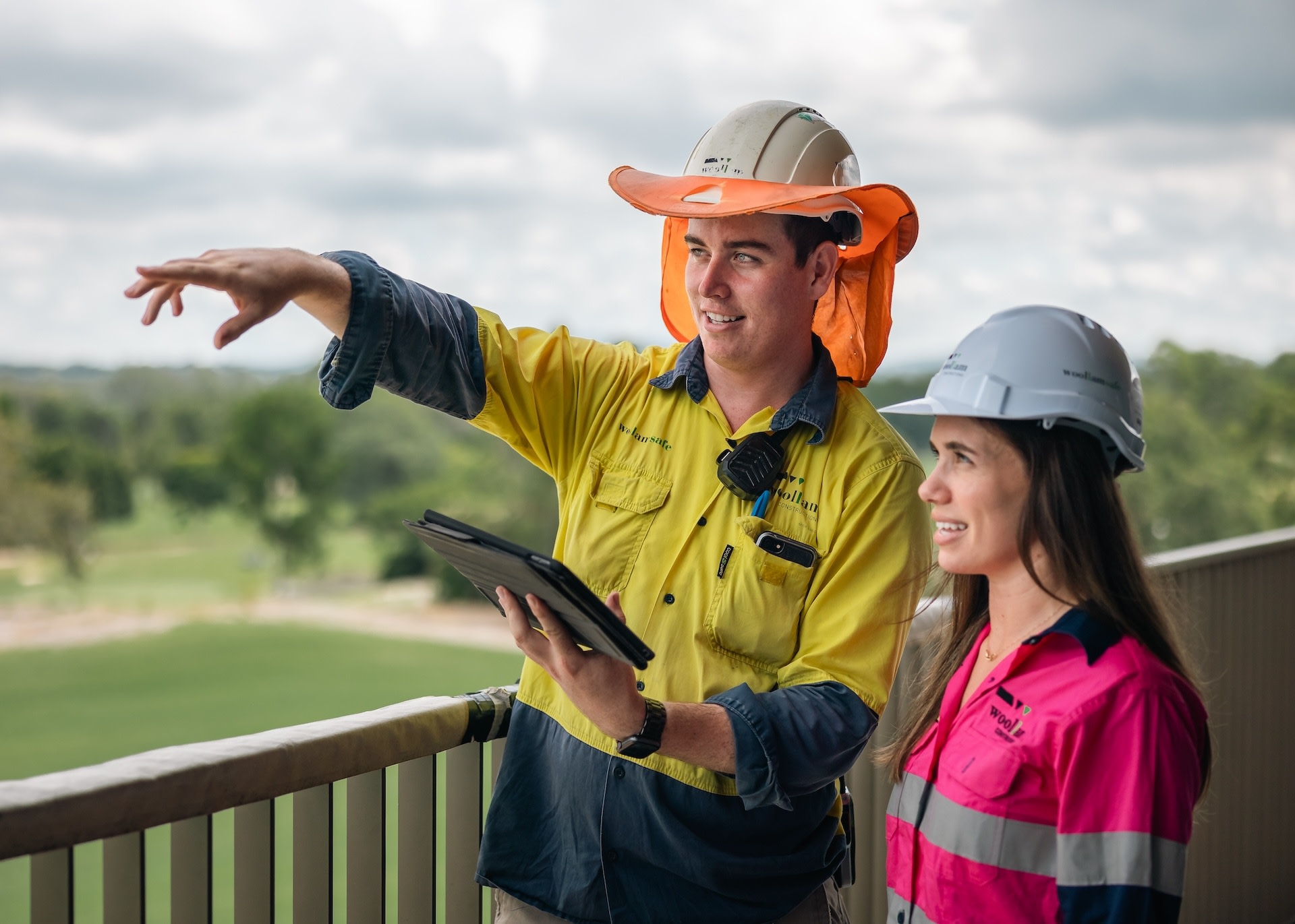 Two contractors using a tablet