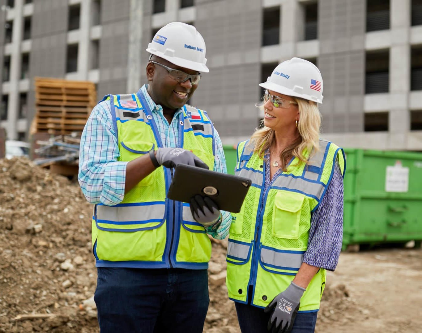 Two contractor's having a conversation on a construction site