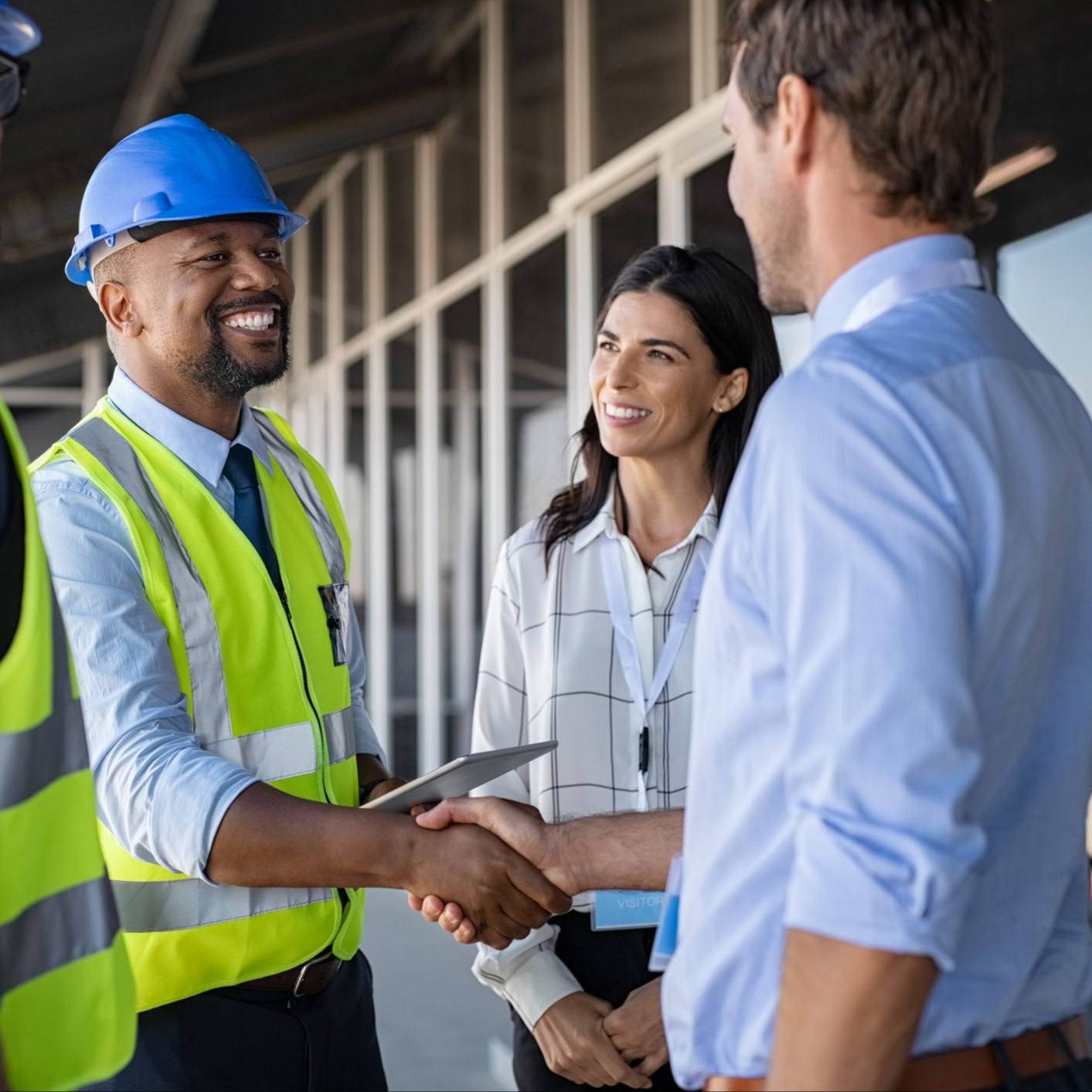 construction workers shaking hands