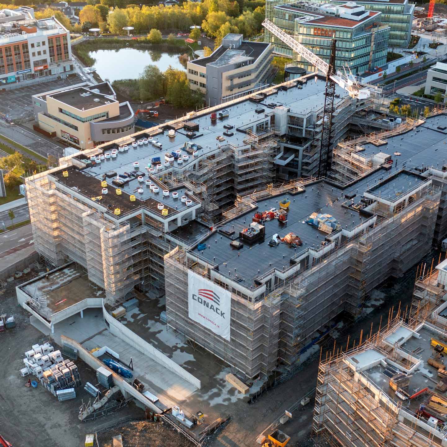 Aerial view of a large building under construction by Conack