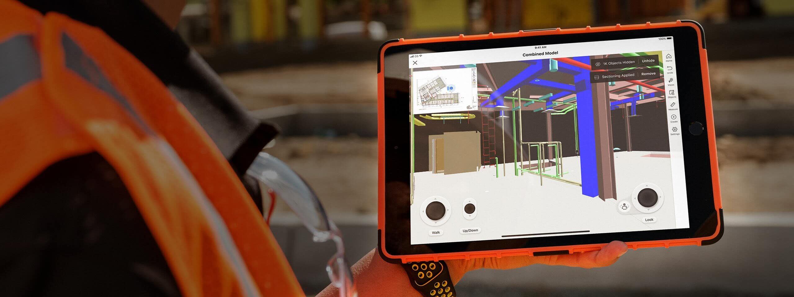Construction worker using BIM on an iPad at a jobsite