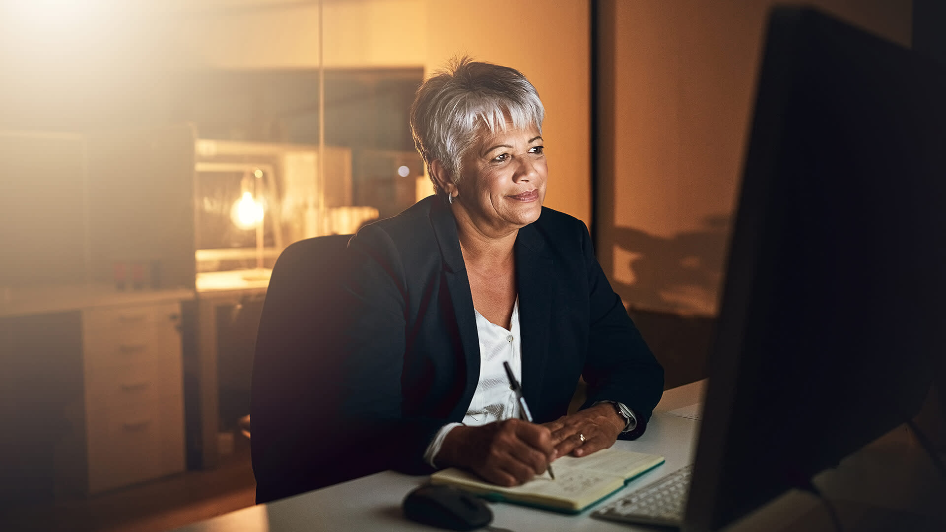 Woman smiling at her computer