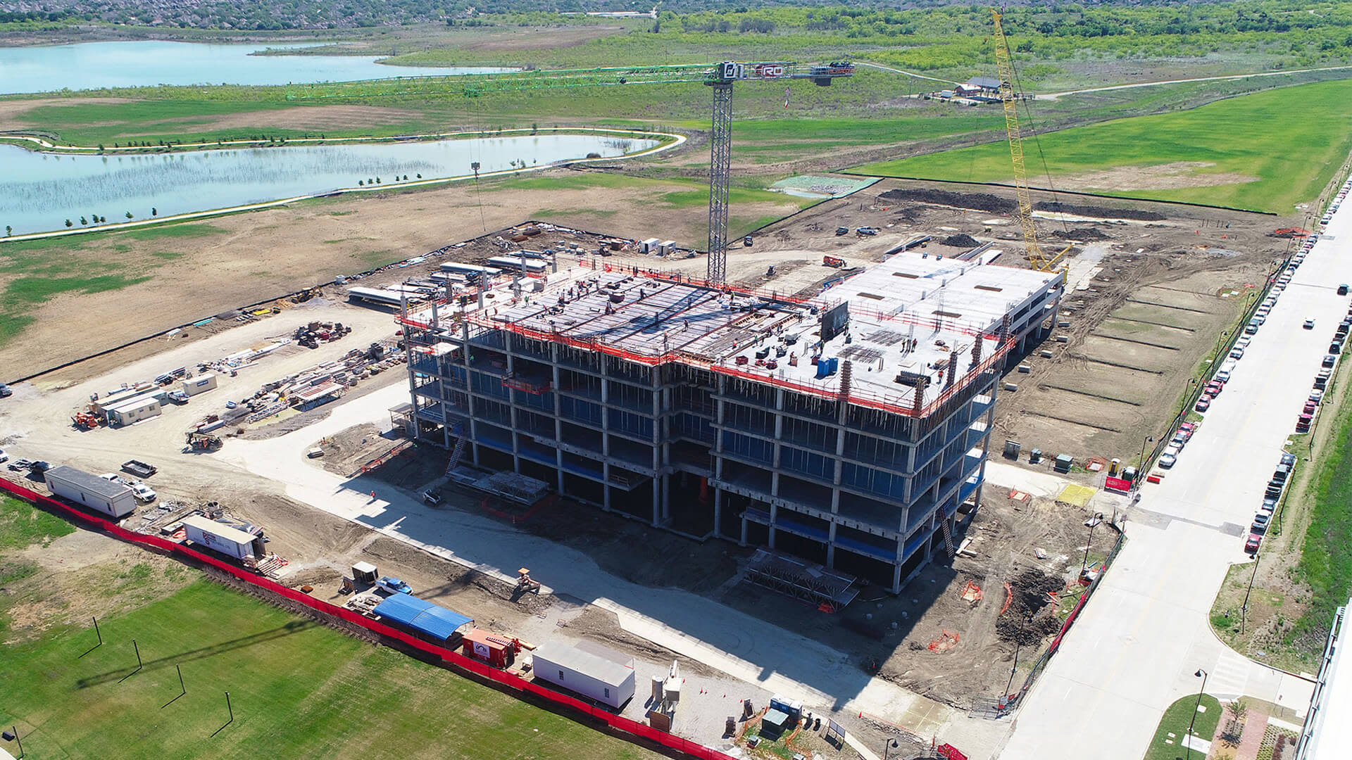 A building under construction next to a lake