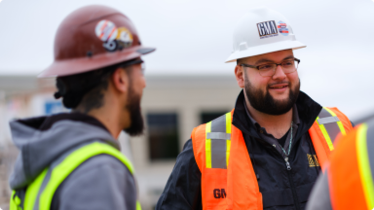 Two construction workers having a conversation