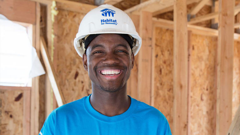Student on site smiling to the camera