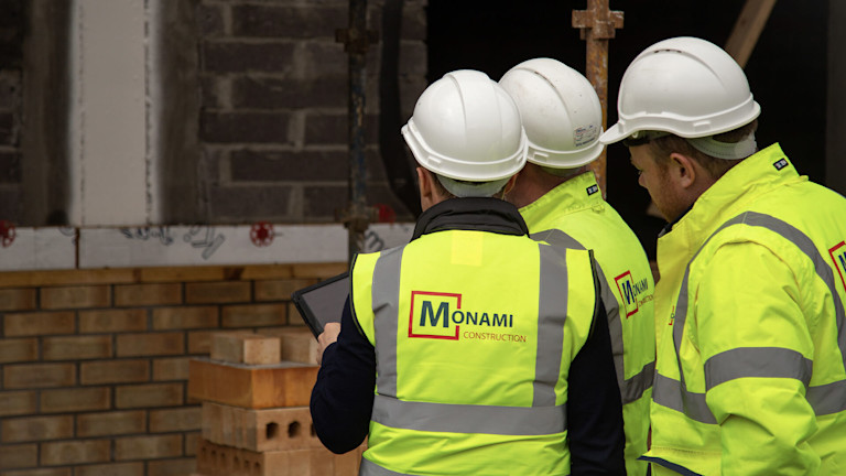 Construction workers in hard hats