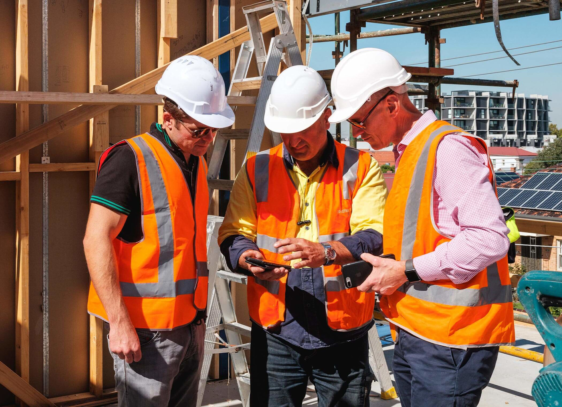 Homebuilders using Procore on a mobile device