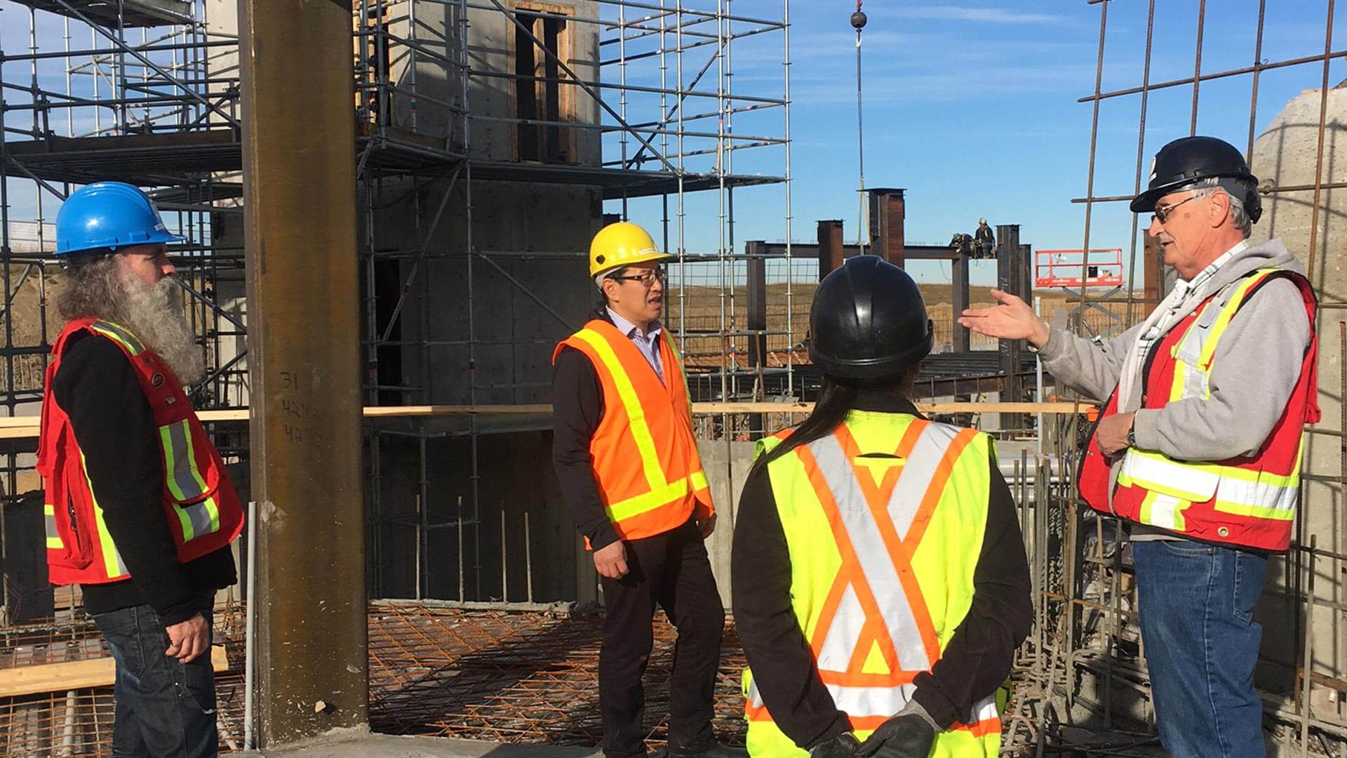 Construction workers discussing the workload