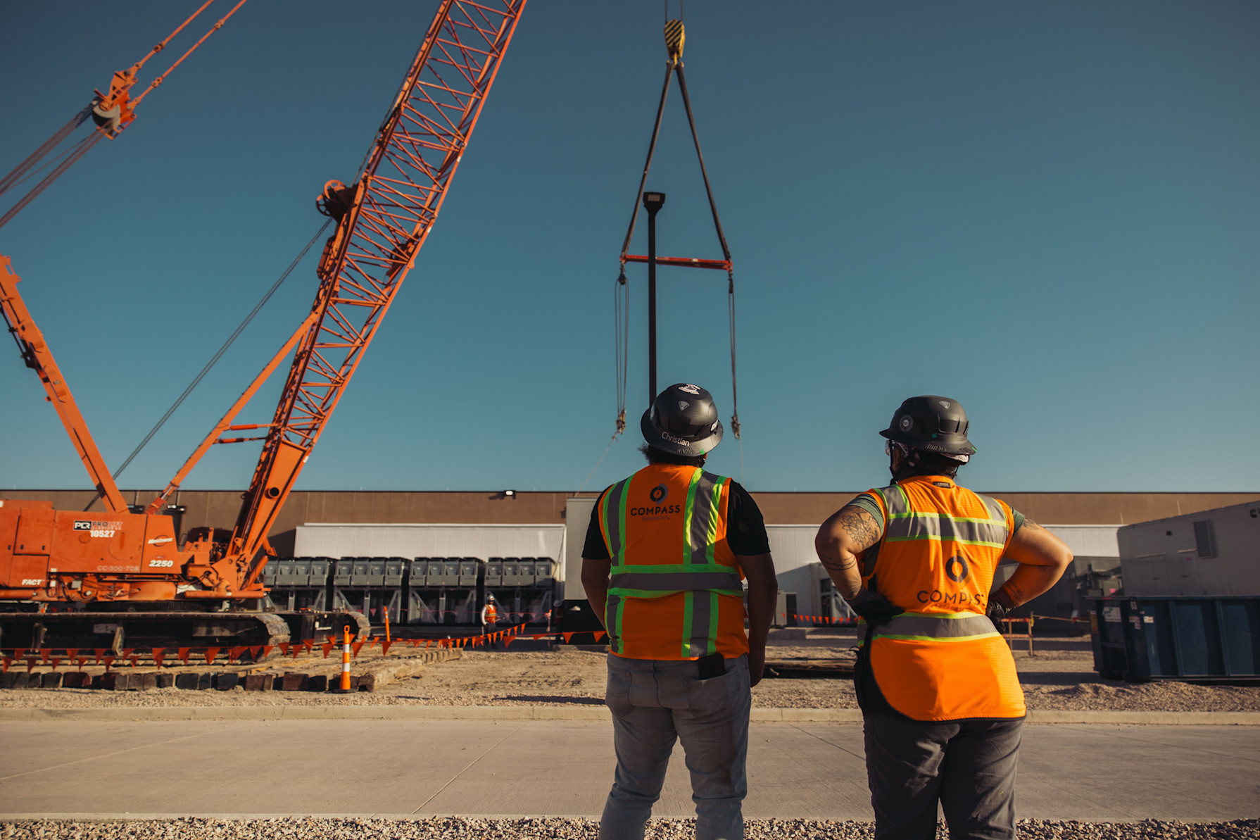 employees standing in front of a datacenter building