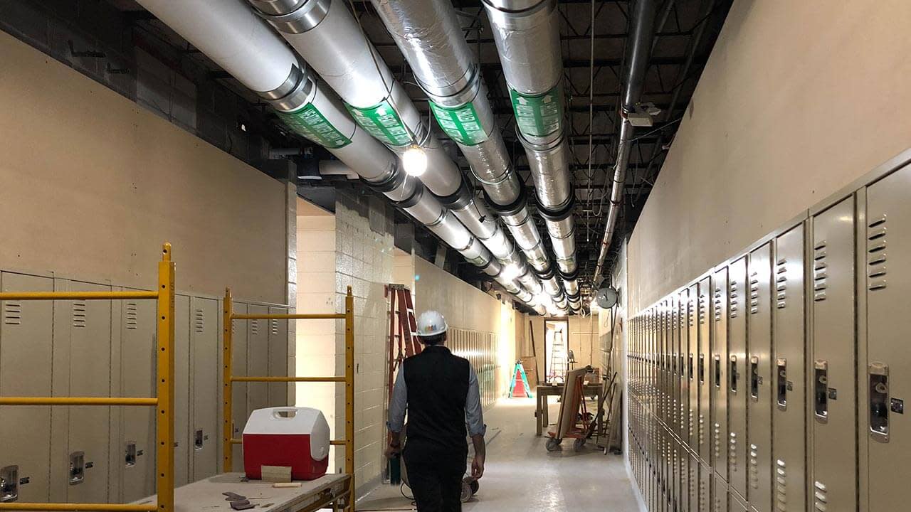 Contractor checking the interior of a school's construction