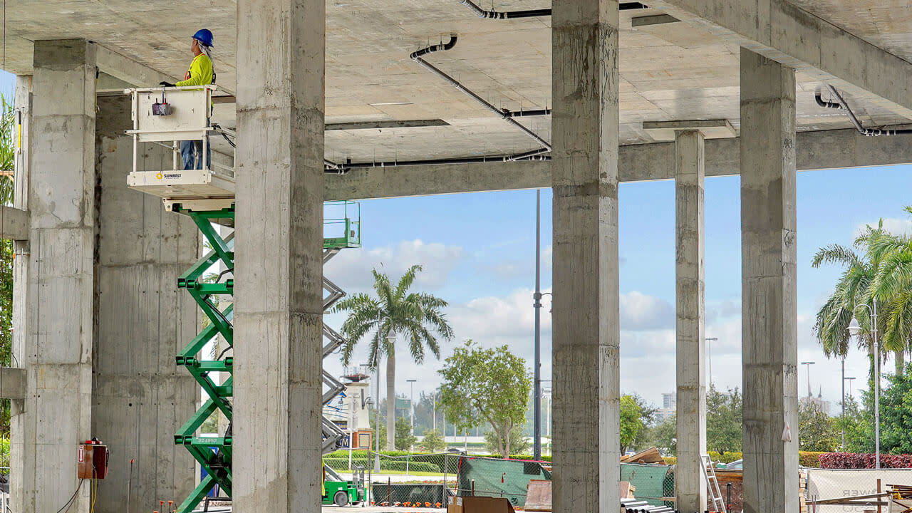 Construction worker on a lift on site