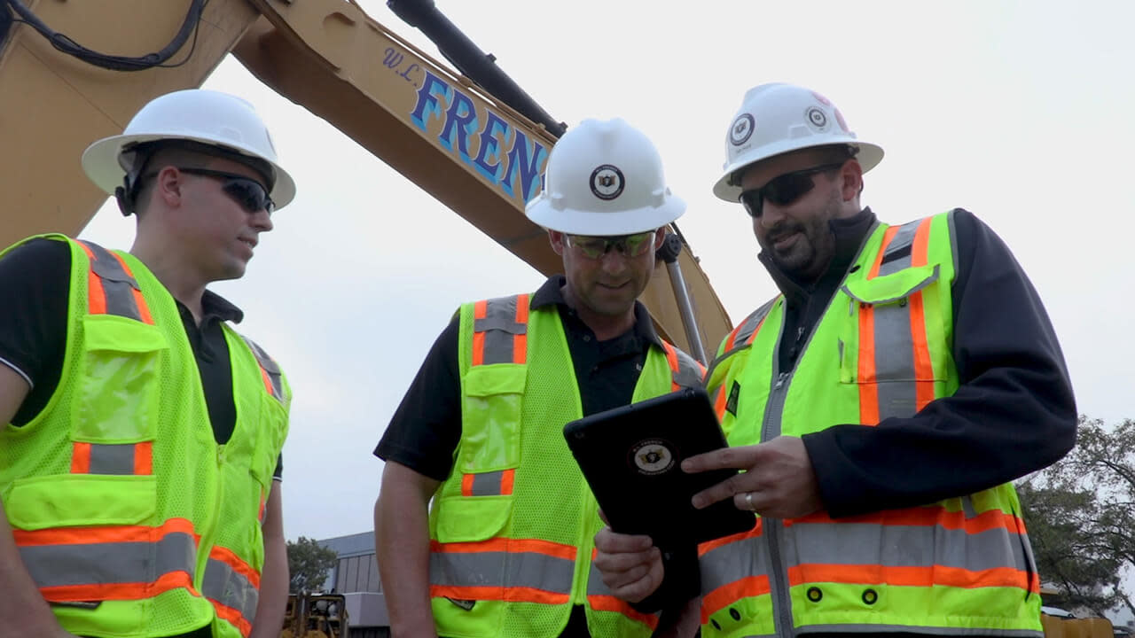 Contractor's using Procore on a tablet