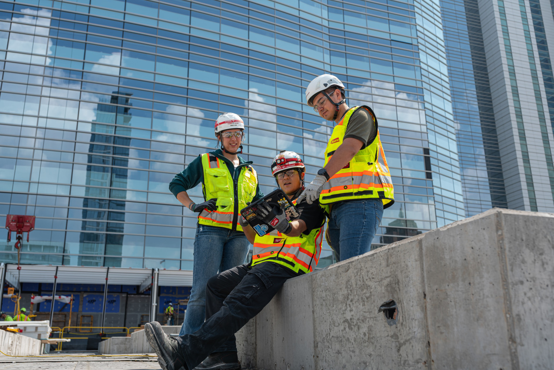 Gilbane employees on a jobsite in front of a building