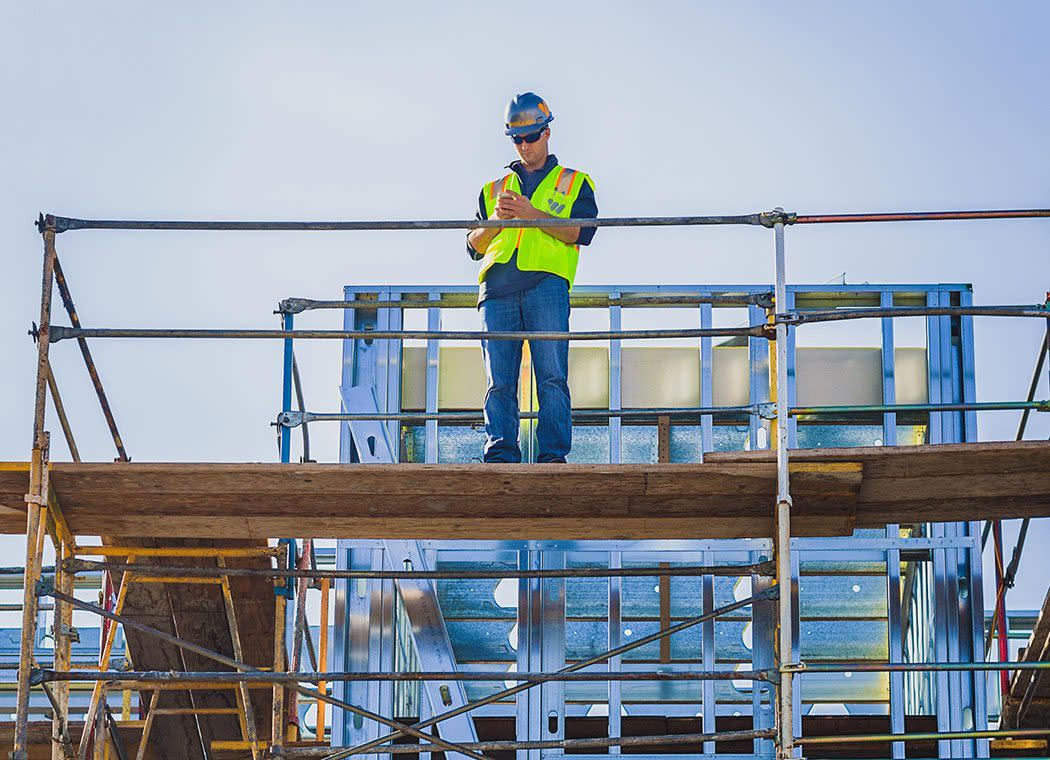 Contractor inspecting a site from the top