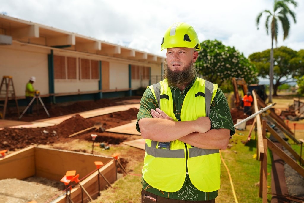 Doug Cullison, program manager for Hawai'i SFA, stands on a school project site.