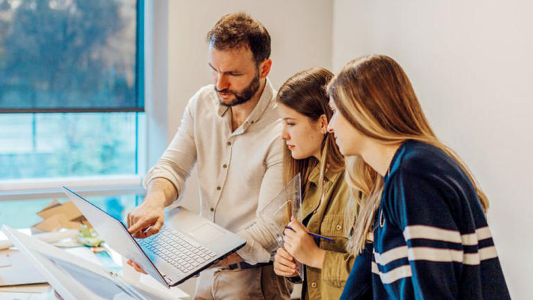 Engineer teaching students