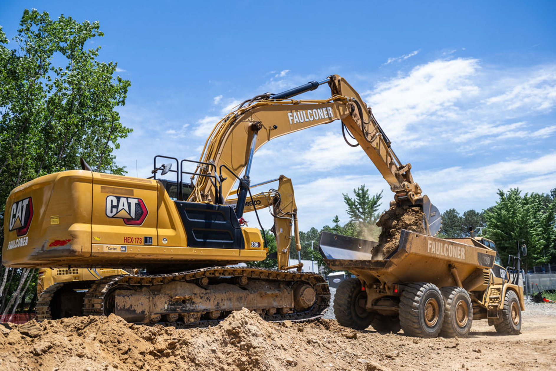 Faulconer dump truck and Excavator