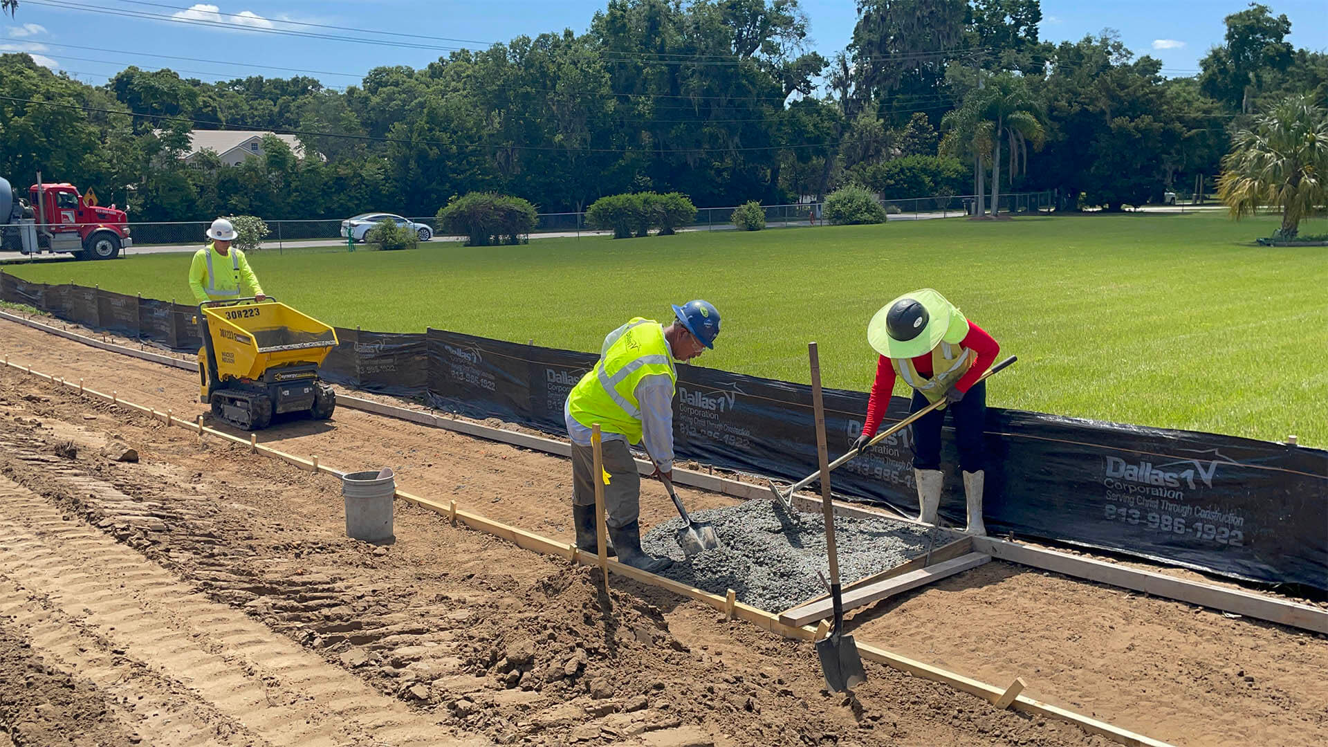 Construction workers pouring concrete