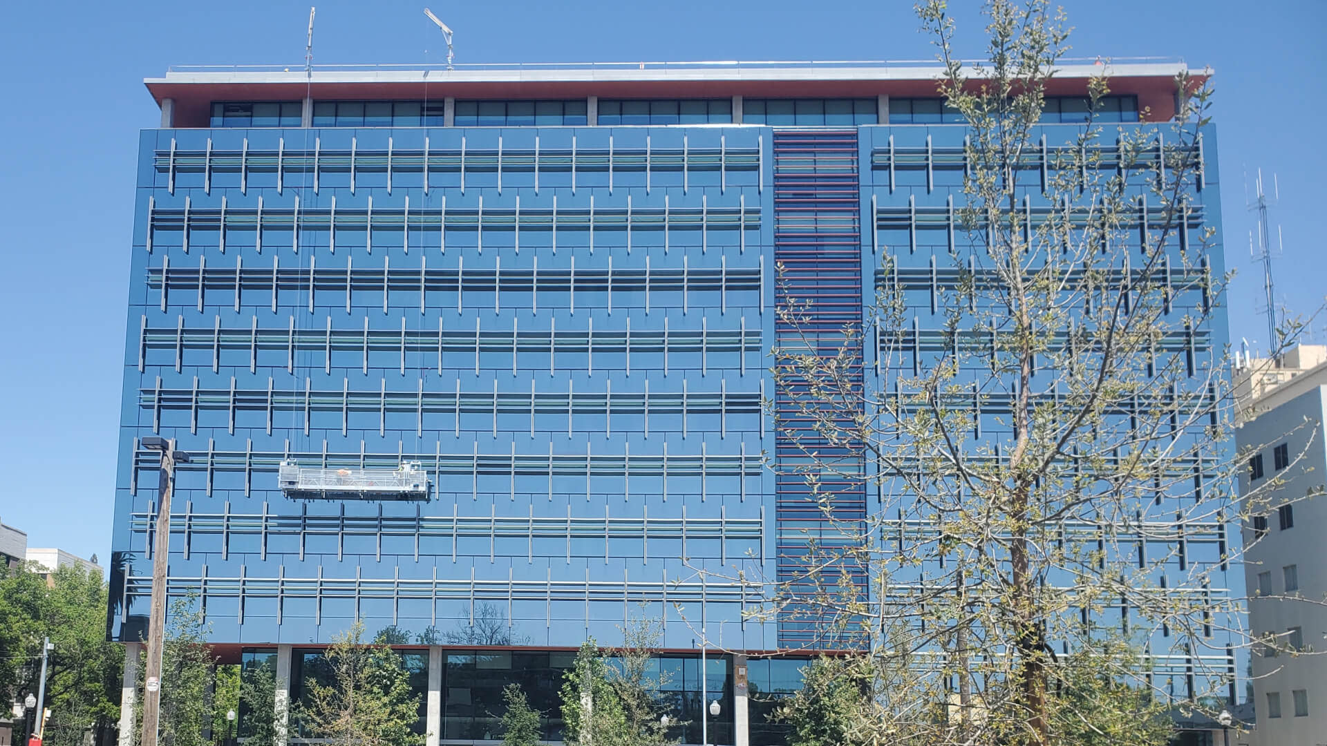 Front view of a mirrored glass building